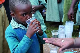 Praziquantal pills cure Schistosomiasis, but they are not available to all Africans.