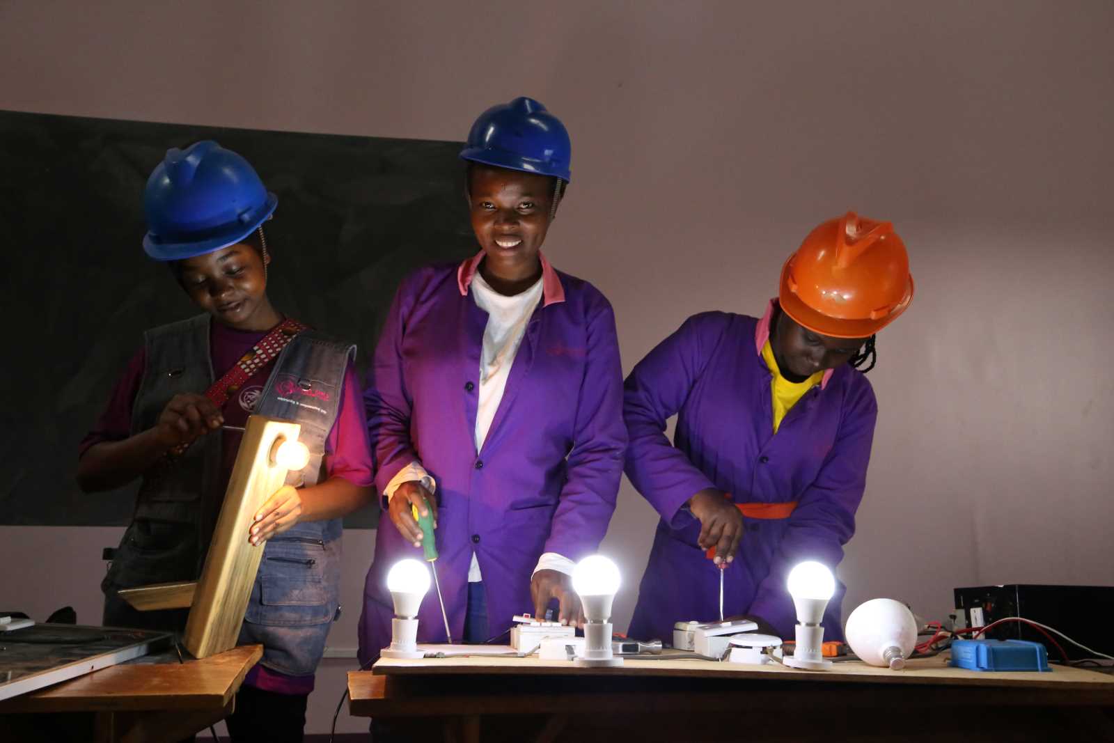 Three participants in the Girls With Tools programme.