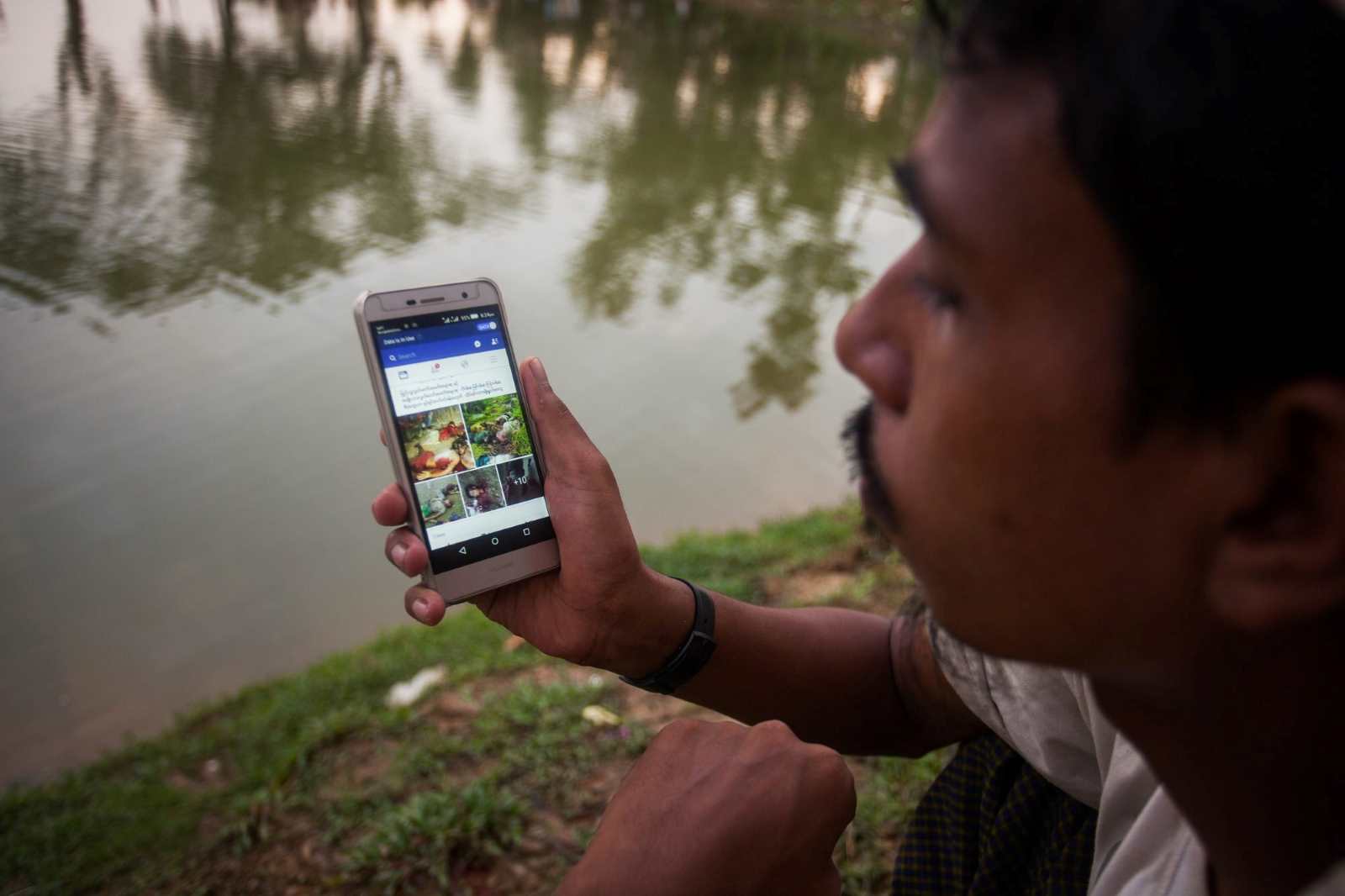 A Rohingya man looking at Facebook in 2017. Social media played a significant role in spreading calls for violence against the Rohingya in Myanmar.