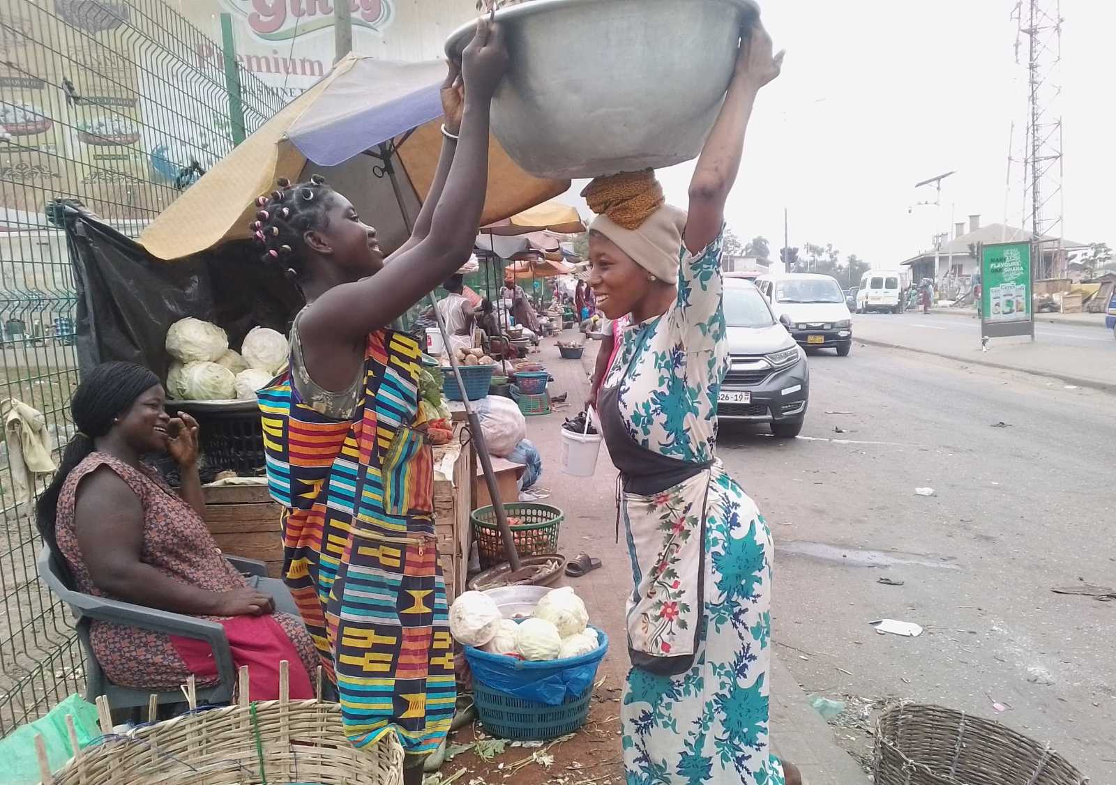 Fouzia carries a load on her head. 