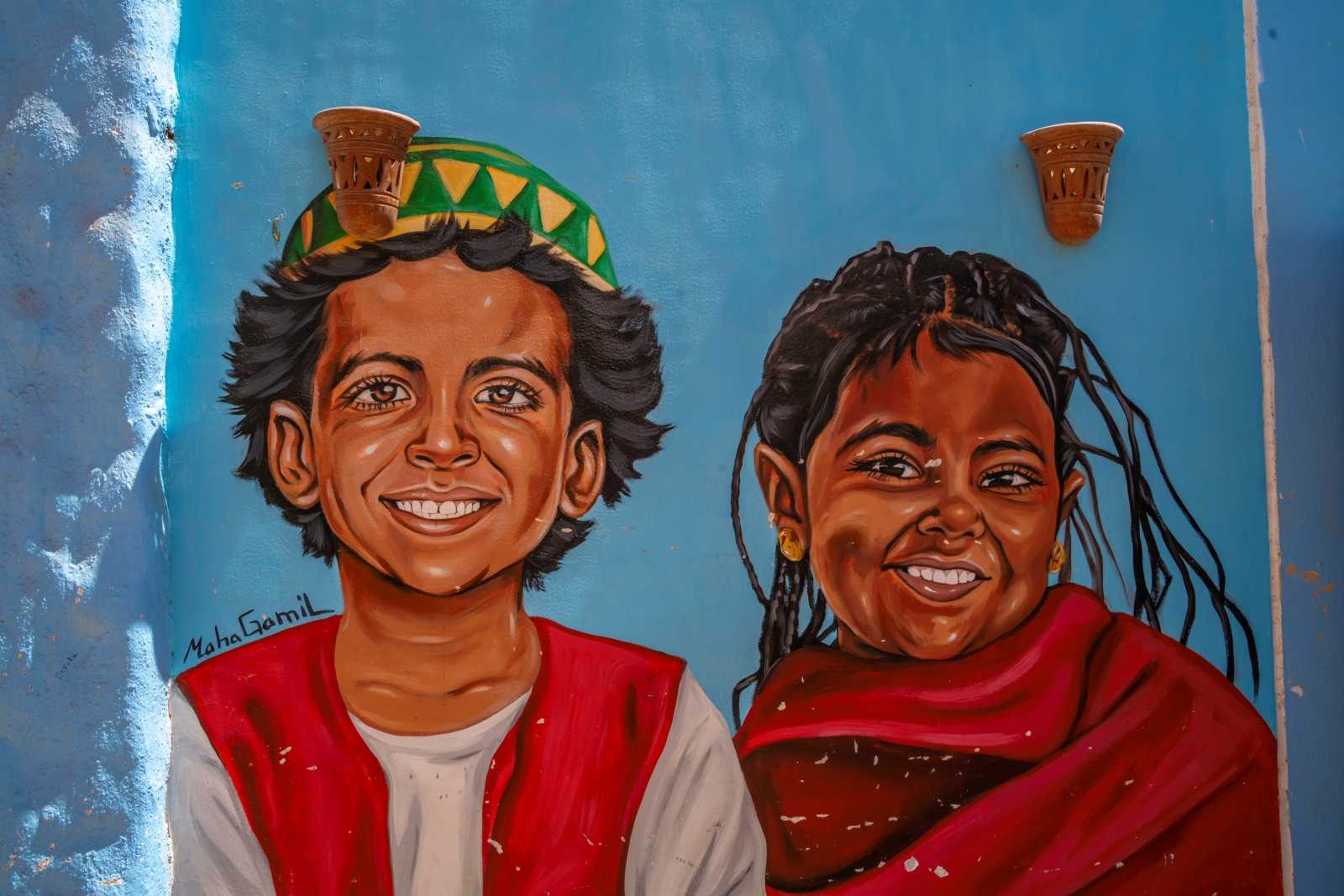 Is there any truth to the claim that young people in Africa always have a smile on their faces? Mural near Aswan, Egypt.
