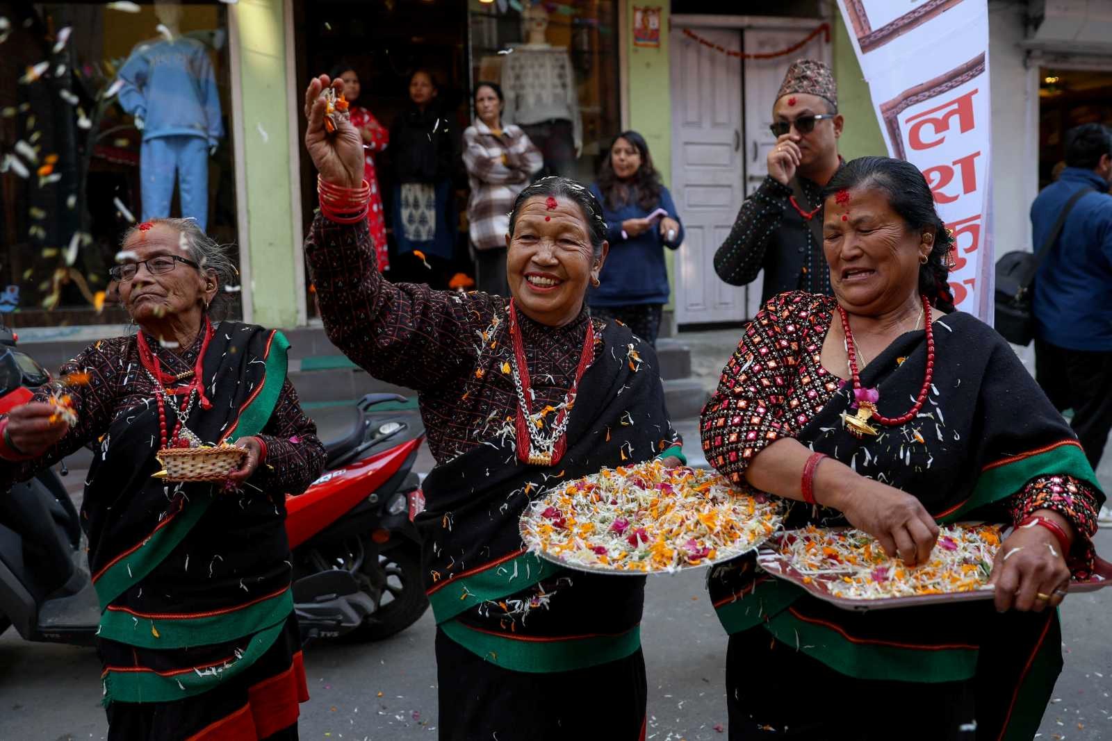 People in traditional attire celebrate the Yomari Punhi festival in Nepal’s capital Kathmandu in December. 