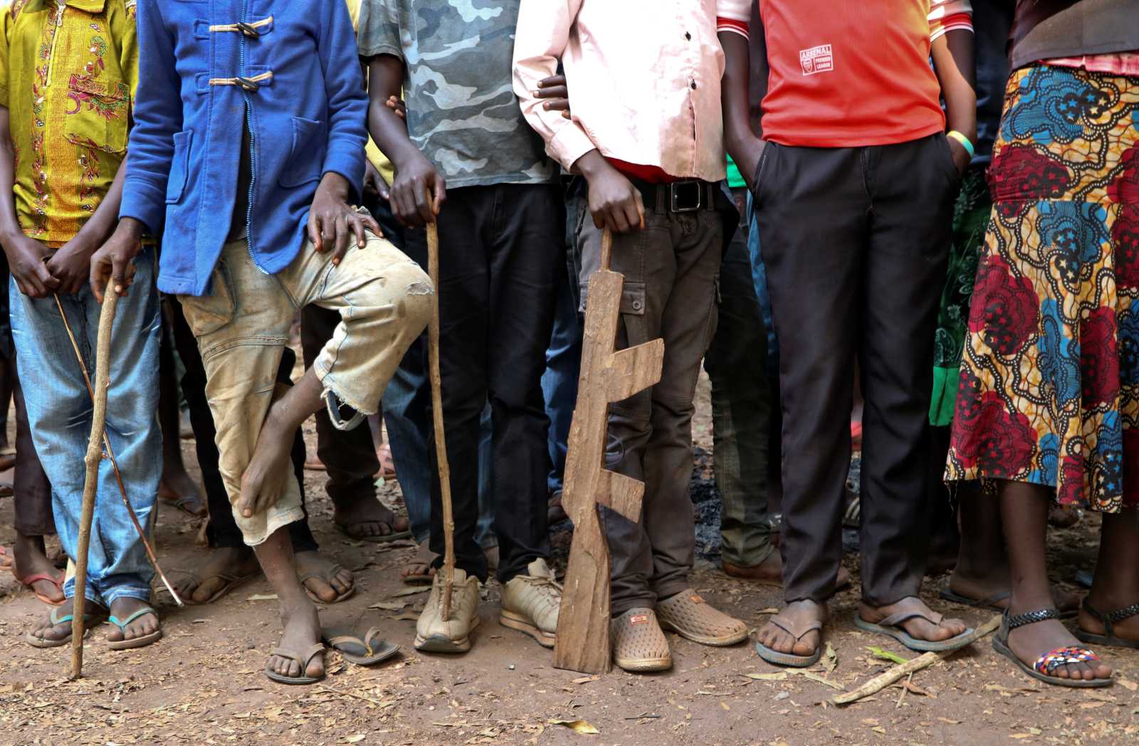Former child soldiers stand in line waiting to be registered with UNICEF to receive a release package, in Yambio, South Sudan.
