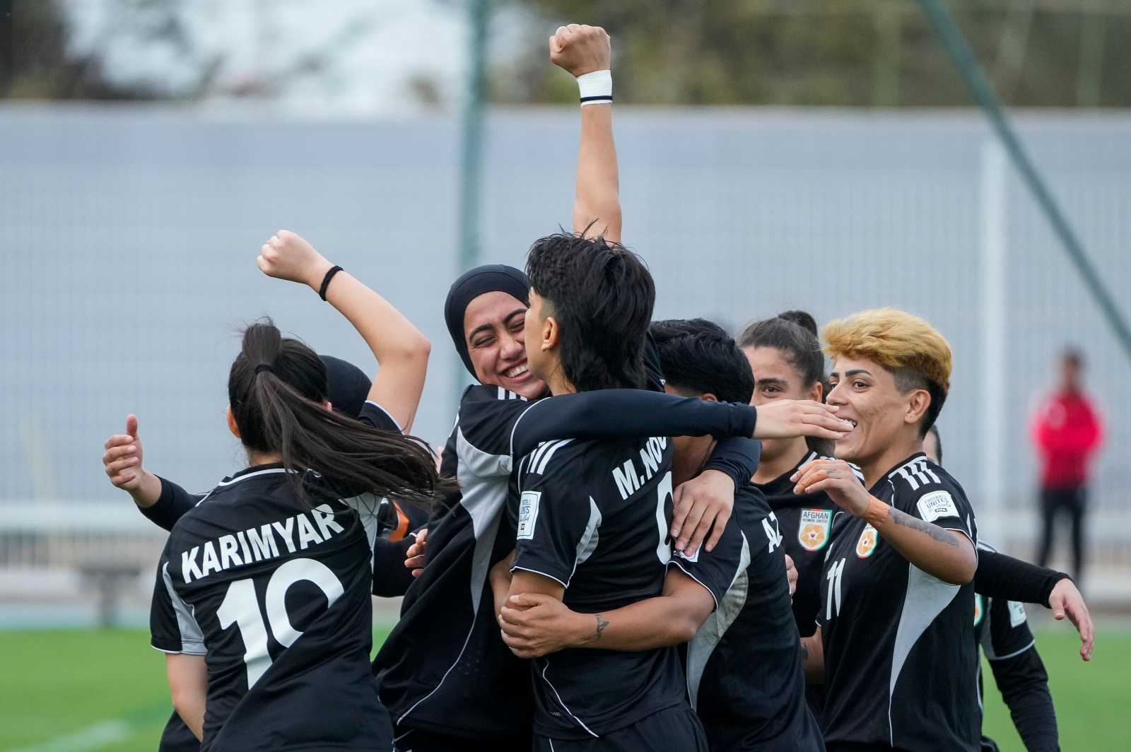 Members of the Afghan women’s team celebrate a goal in October 2025. At the time, the team was still competing under the name “Afghan Women United”. 
