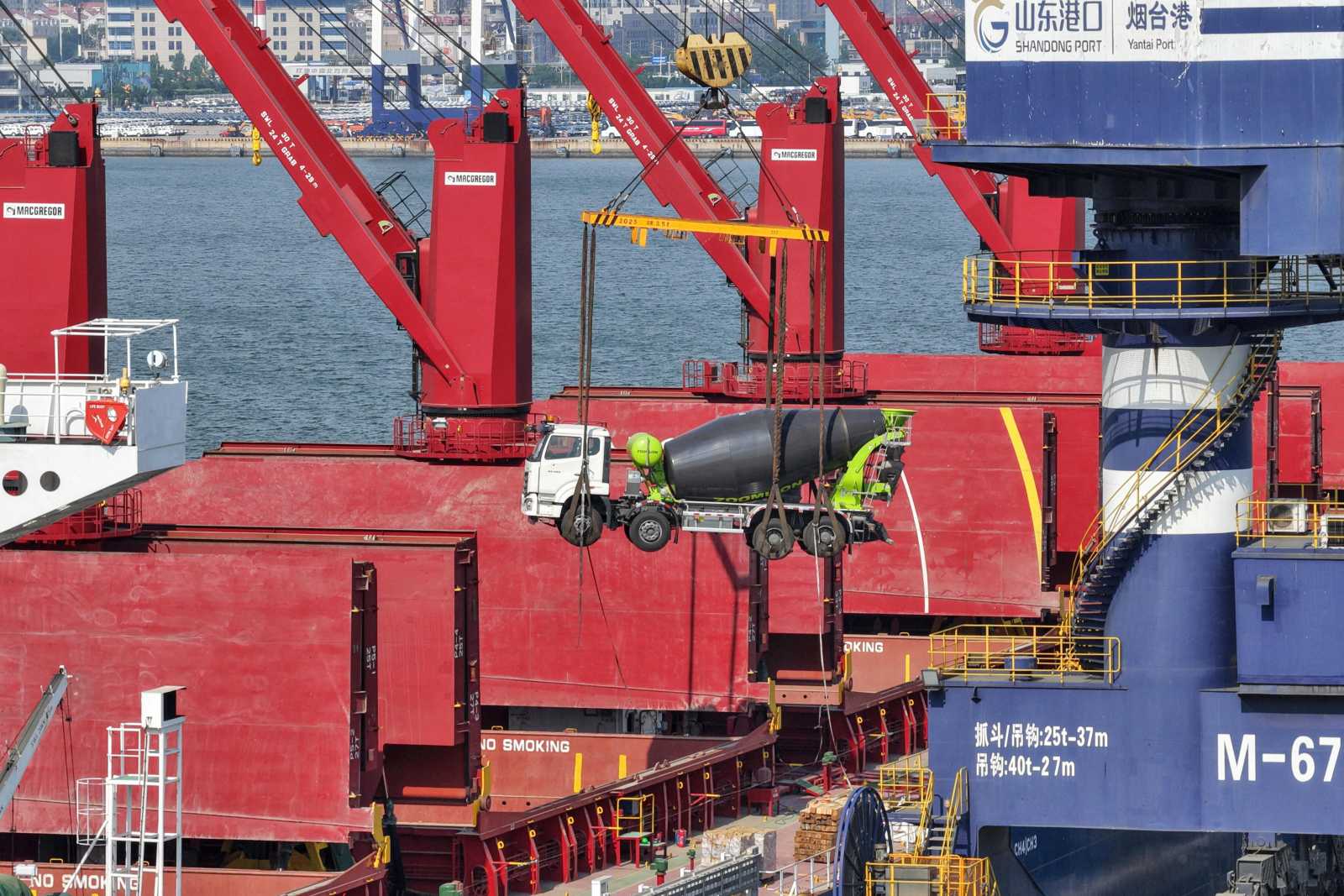 A China-made truck for export to Africa is loaded onto a China-Africa shipping route at Yantai Port in Shandong Province.