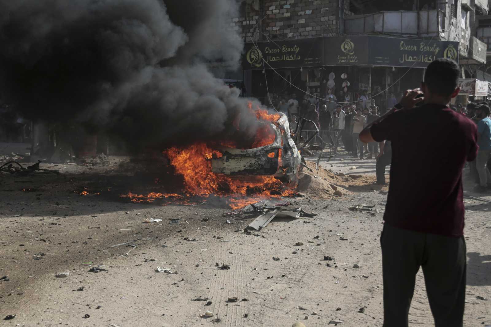 The violence in Gaza continues: an Israeli air strike hit this vehicle and the people inside it in Gaza City on 19 September.