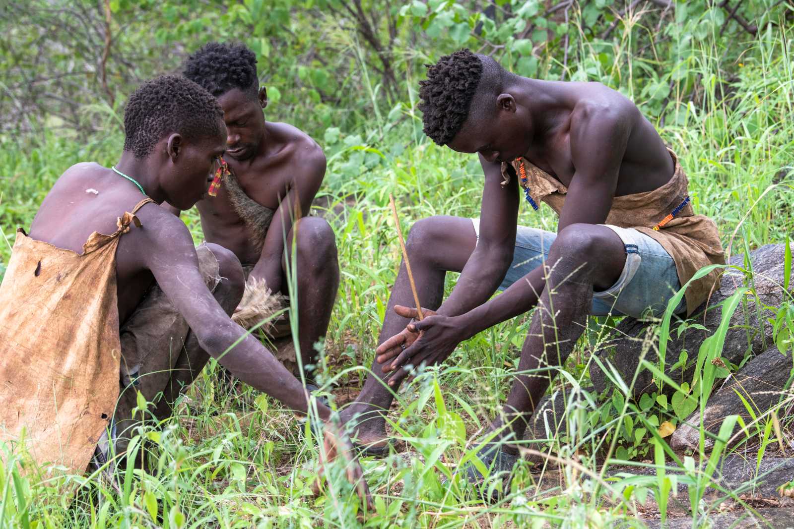 Hadzabe hunters light a fire near Lake Eyasi in northern Tanzania.