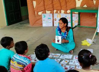 Santali-speaking children being educated in their native language in Bengali script. 