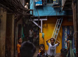 Lane in a Mumbai slum: poor children were largely abandoned during the pandemic. 