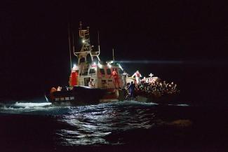 Italian Coast Guard rescuing refugees in the central Mediterranean. 