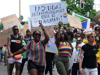 Members of the LGBTQ community protest at the Munich Christopher Street Day – in Uganda they might go to jail for this.