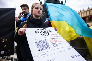 Russia should pay for the cost of the war in Ukraine. Banner at a Solidarity With Ukraine rally staged in February in Krakow, Poland.