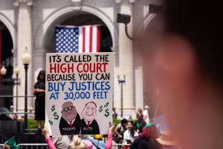 Justices of the Supreme Court have gone on luxury trips paid by plutocrats – protest in Washington. 