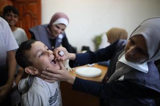 A boy receiving his dose of polio vaccine in a Gazan refugee camp on 2 September 2024.