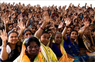 SEWA At the Self Employed Women’s Association of India (SEWA), it’s all about collective action: voting at a union meeting.