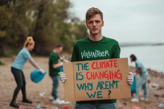 Adobe The climate is changing, why aren’t we? People at a river cleanup.