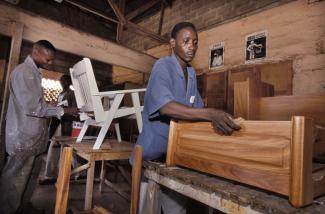 Work must go on – a carpenter in Benin in better times.
