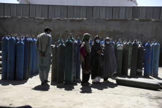 The Delta variant is reality: people waiting to get refilled oxygen cylinders for sick family members.