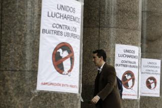 Government-sponsored posters in Buenos Aires in July: “Together we’ll fight the loan vultures.”