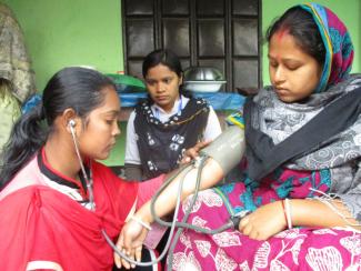 Paramedic providing prenatal care.