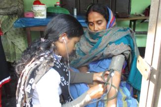 Paramedic providing antenatal and postnatal care on behalf of GK in a village.