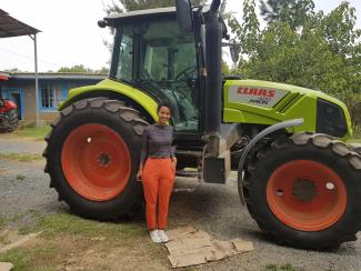 Samrawit Kiros Haylu in front of one of the new tractors. She is the first driving instructor ever in Ethiopia.