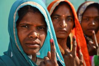 Gond women showing the ink marks that indicate they took part in the state elections in Madhya Pradesh in late 2018.