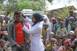 Mobile health workers educate rural villagers in Ethiopia on trachoma, a disease caused by bacteria that leads to a loss of eyesight if left untreated.