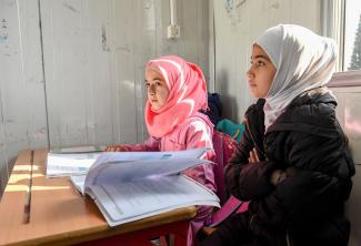 Faith makes strong: two Syrian girls from the Idlib region in a refugee camp in Lebanon.