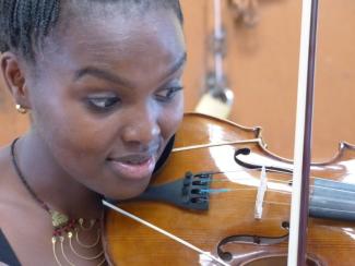 Young violinist from Korogocho.
