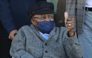 Desmond Tutu, archbishop emeritus, gestures after receiving a vaccine shot in Cape Town in May.