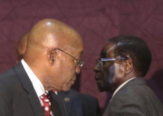 Mutually supportive: The presidents of South >frica and Zimbabwe, Jacob Zuma and Robert Mugabe.