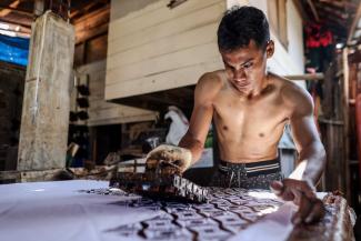 Printing traditional Javanese textile patterns in a small-scale workshop.