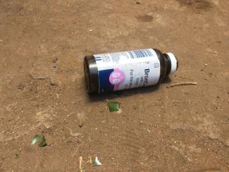 Empty BronCleer bottle on a street in Harare.