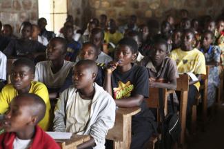 Children belong in school instead of working: class in Burundi.
