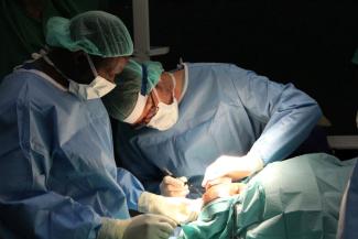 MSF doctors operate a six-year-old child to reconstruct a hole in his jaw and damage to his eye, caused by Noma, at the Children’s hospital in Sokoto State, northwest Nigeria.