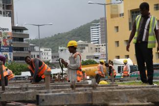 Mauritius is losing its beaches to erosion, as here in Belle Mare at the east coast. , Building a light-rail transportation system is one of Mauritius’ measures to curb emissions. Construction site of the Metro Express in Port Louis, the capital city.