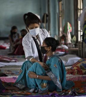 Examining a patient in Assam.