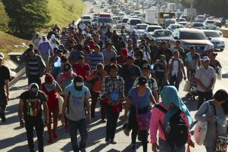 Migrant caravan  from Honduras on a highway in El Salvador in January 2019. People try to get to the USA on foot.
