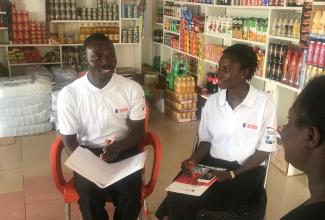 STCCI employees Abigail Asante (r.) and Aidoo Atta Panyin collect data for the business-condition report in the Western Region of Ghana.