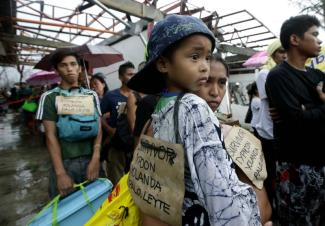 Survivors of Typhoon Yolanda in the Philippines: Their plight became a testing ground in 2013 for private investment and profit opportunities.